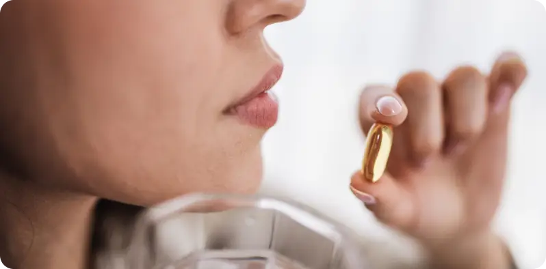 Woman holding a plasmalogen supplement
